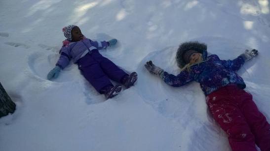 My nieces taking a snow angel break on our day of sledding. :)